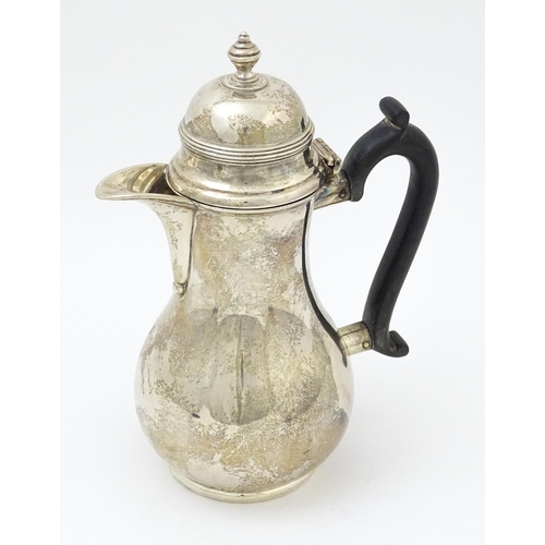 651 - A silver coffee / hot water pot hallmarked London 1909, maker Ackroyd Rhodes; Manoah Rhodes & Sons L... 