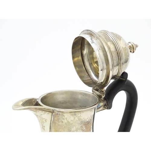 651 - A silver coffee / hot water pot hallmarked London 1909, maker Ackroyd Rhodes; Manoah Rhodes & Sons L... 