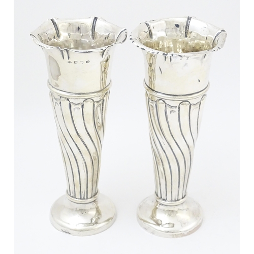 652 - A pair of Victorian silver vases with fluted detail hallmarked Birmingham 1899, maker Robert Pringle... 