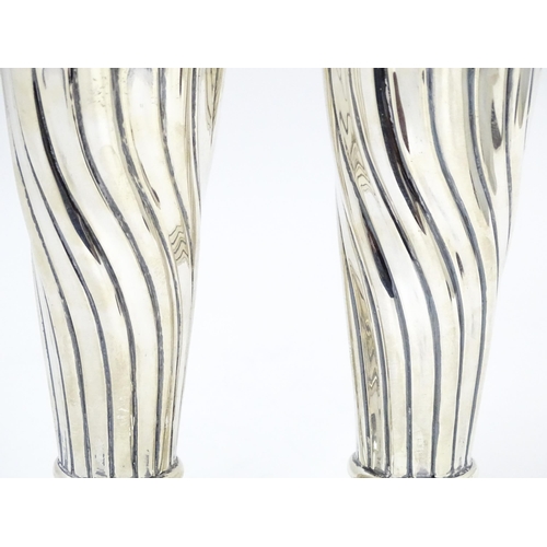 652 - A pair of Victorian silver vases with fluted detail hallmarked Birmingham 1899, maker Robert Pringle... 