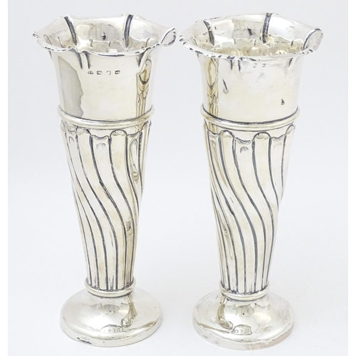 652 - A pair of Victorian silver vases with fluted detail hallmarked Birmingham 1899, maker Robert Pringle... 