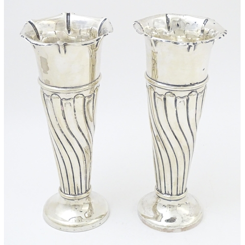 652 - A pair of Victorian silver vases with fluted detail hallmarked Birmingham 1899, maker Robert Pringle... 