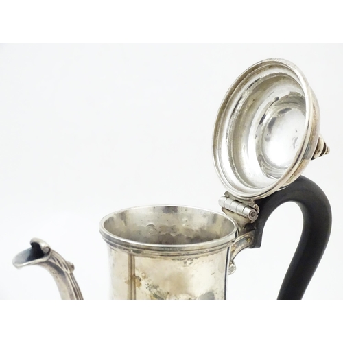 653 - A Geo II silver coffee pot hallmarked London c. 
1752, maker Thomas Whipham. Approx. 8 1/2