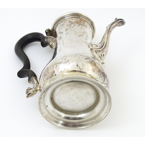 653 - A Geo II silver coffee pot hallmarked London c. 
1752, maker Thomas Whipham. Approx. 8 1/2