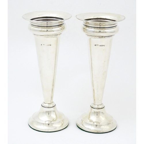 654 - A pair of silver vases hallmarked Birmingham 1927, maker Deakin & Francis. Approx. 7