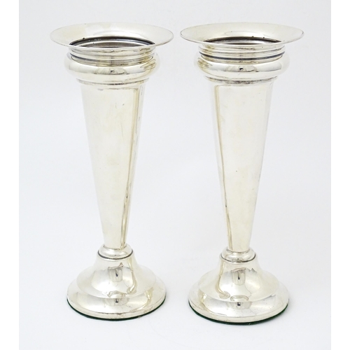 654 - A pair of silver vases hallmarked Birmingham 1927, maker Deakin & Francis. Approx. 7