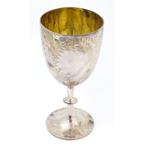 655 - A Victorian silver goblet with engraved fern decoration and gilded interior, hallmarked London 1878,... 