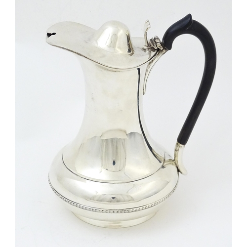 656 - A silver coffee / hot water pot hallmarked Birmingham 1912, maker Synyer & Beddoes. Approx. 6 1/2