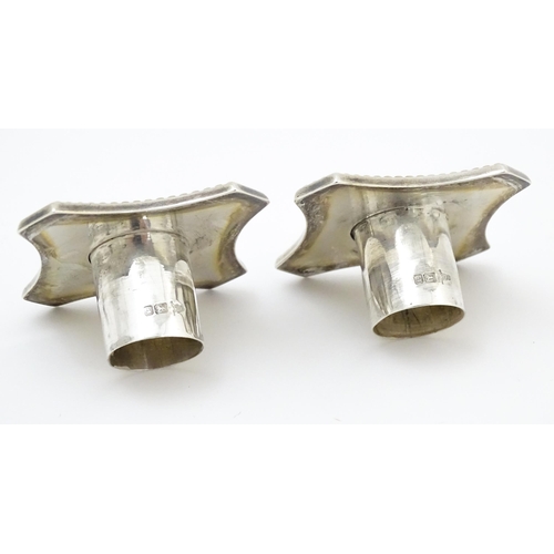 657 - A pair silver candlesticks of Corinthian column form with squared stepped bases, hallmarked Sheffiel... 