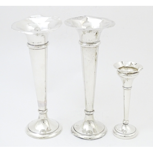 659 - A pair of silver bud vases hallmarked Birmingham 1903, maker A. & J. Zimmerman Ltd. Together with a ... 