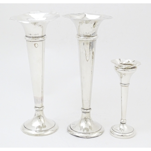 659 - A pair of silver bud vases hallmarked Birmingham 1903, maker A. & J. Zimmerman Ltd. Together with a ... 