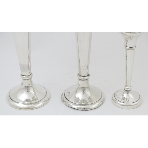 659 - A pair of silver bud vases hallmarked Birmingham 1903, maker A. & J. Zimmerman Ltd. Together with a ... 