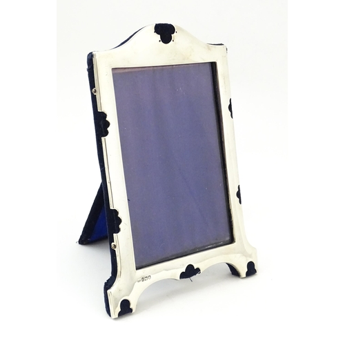 663 - An easel back photograph frame with silver surround, hallmarked London 1902, maker Samuel Jacob. App... 