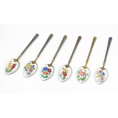 670 - A cased set of six silver gilt teaspoons, the bowl backs with enamel decoration depicting various fl... 