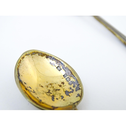 670 - A cased set of six silver gilt teaspoons, the bowl backs with enamel decoration depicting various fl... 