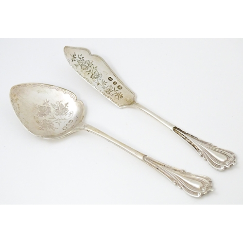 673 - A Victorian silver butter knife and preserve spoon hallmarked Birmingham 1895, maker Joseph Gloster.... 