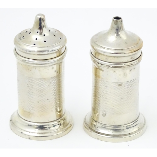 676 - An Art Deco silver three piece cruet set comprising salt, pepper and mustard pot, hallmarked Birming... 