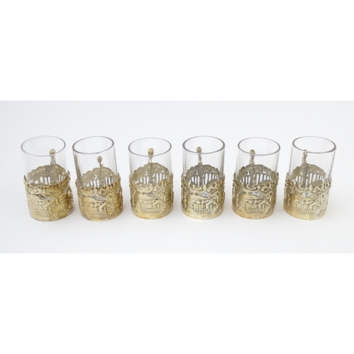 680 - A cased set of six tot glasses with silver holders hallmarked Birmingham 1911, maker William Comyns ... 