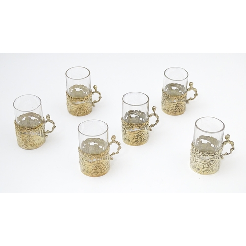 680 - A cased set of six tot glasses with silver holders hallmarked Birmingham 1911, maker William Comyns ... 