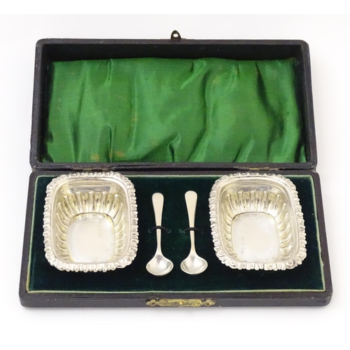 682 - A pair of silver salts hallmarked Birmingham 1908, maker Robert Pringle & Sons. Together with associ... 