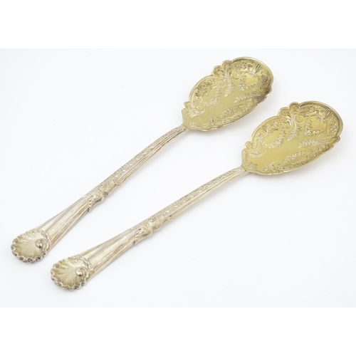 683 - A pair of Victorian silver serving spoons with gilt bowls, hallmarked Sheffield 1899, maker Walker &... 