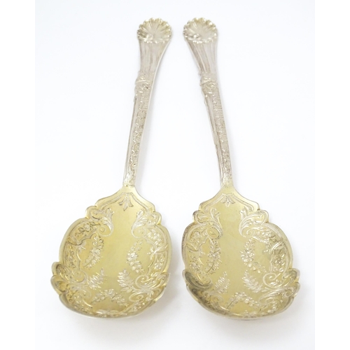 683 - A pair of Victorian silver serving spoons with gilt bowls, hallmarked Sheffield 1899, maker Walker &... 