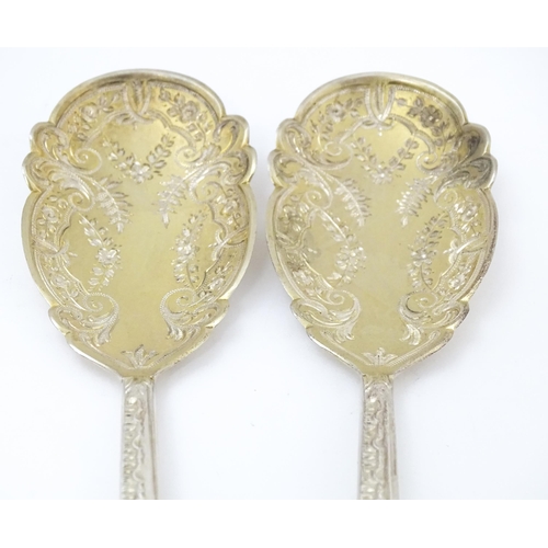 683 - A pair of Victorian silver serving spoons with gilt bowls, hallmarked Sheffield 1899, maker Walker &... 