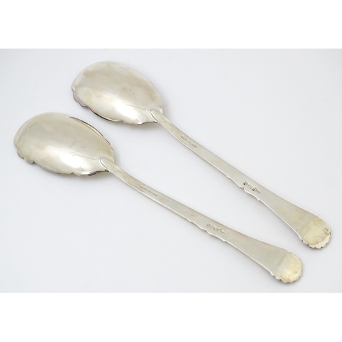 683 - A pair of Victorian silver serving spoons with gilt bowls, hallmarked Sheffield 1899, maker Walker &... 