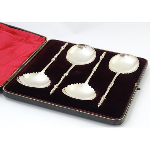 684 - A cased set of four silver serving spoons, hallmarked London 1905, maker Goldsmiths & Silversmiths C... 