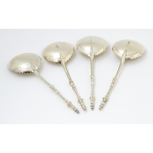 684 - A cased set of four silver serving spoons, hallmarked London 1905, maker Goldsmiths & Silversmiths C... 