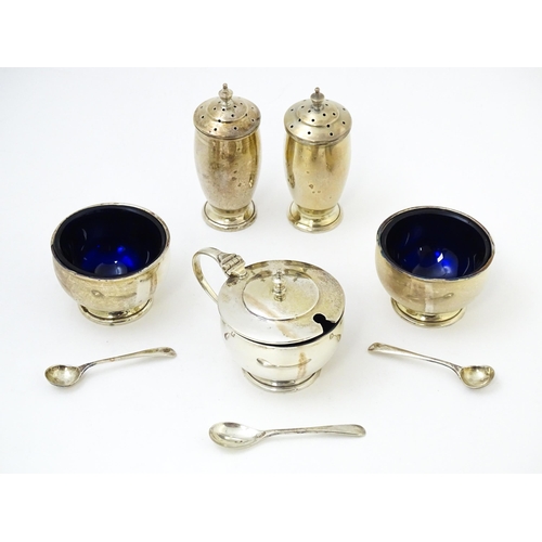 686 - An Art Deco silver five piece cruet set comprising, salts, peppers and mustard pot, hallmarked Birmi... 