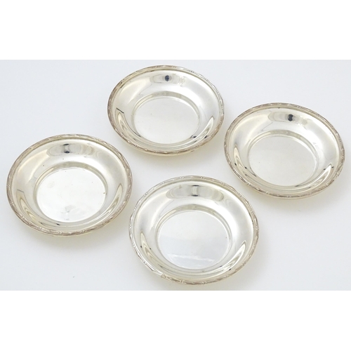 688 - A cased set of four silver bon bon dishes / small coasters, hallmarked London 1922, maker Garrard & ... 