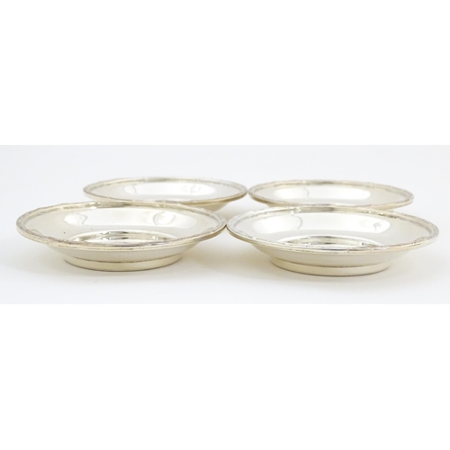 688 - A cased set of four silver bon bon dishes / small coasters, hallmarked London 1922, maker Garrard & ... 