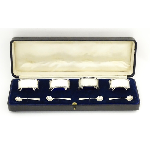 689 - A cased set of four silver salts hallmarked Chester 1916, maker Stokes & Ireland Ltd. Together with ... 