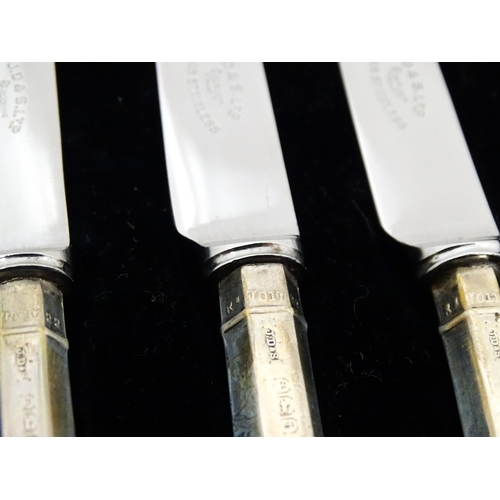 690 - A cased set of six silver handled tea knives titled The Queen Anne Tea Knife (The handle adapted fro... 