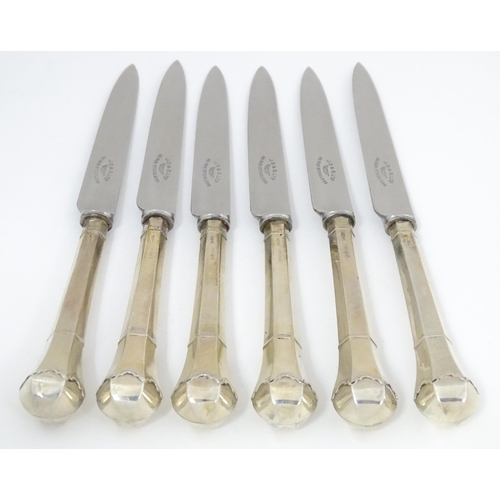 690 - A cased set of six silver handled tea knives titled The Queen Anne Tea Knife (The handle adapted fro... 