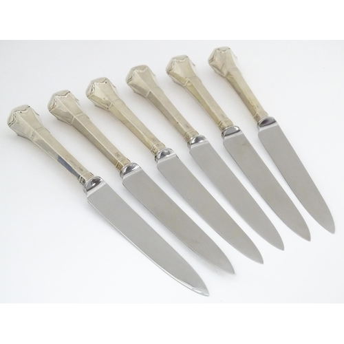 690 - A cased set of six silver handled tea knives titled The Queen Anne Tea Knife (The handle adapted fro... 