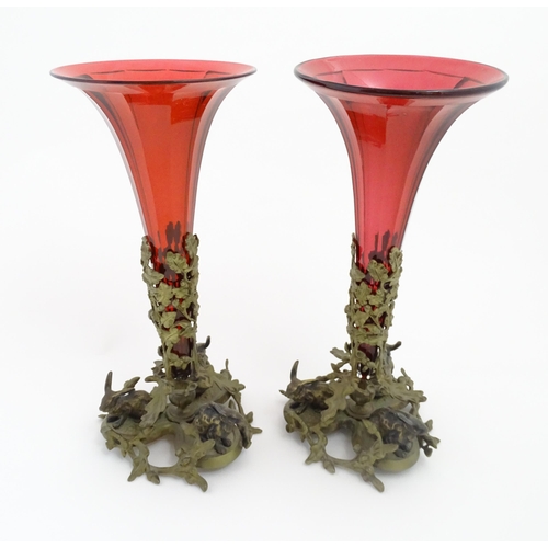 264 - Two epergne / centrepiece vases the ruby glass flutes supported by gilt metal bases decorated with o... 