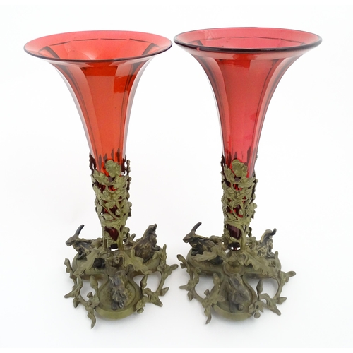 264 - Two epergne / centrepiece vases the ruby glass flutes supported by gilt metal bases decorated with o... 