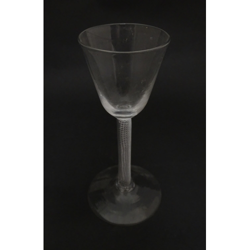 277 - A 19thC pedestal cordial glass with air twist stem.  Approx 6 1/2