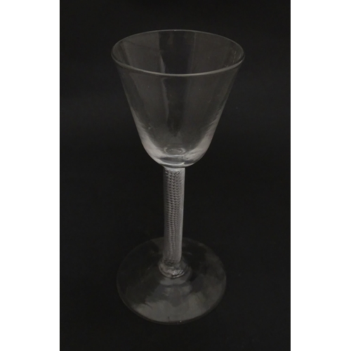 277 - A 19thC pedestal cordial glass with air twist stem.  Approx 6 1/2