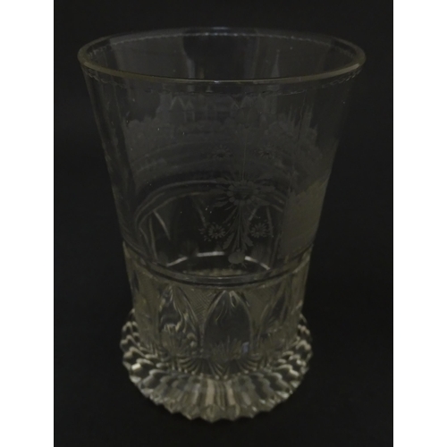 279 - A Continental drinking glass with cut decoration and etched scene depicting a Continental town lands... 