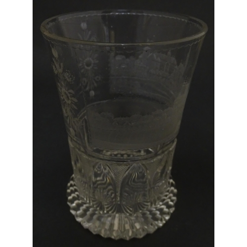 279 - A Continental drinking glass with cut decoration and etched scene depicting a Continental town lands... 