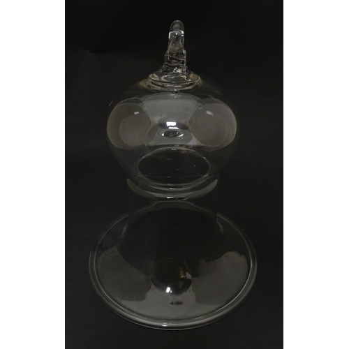 281 - A 19thC glass bell formed cover / cloche with folded foot base. Approx 8 1/2