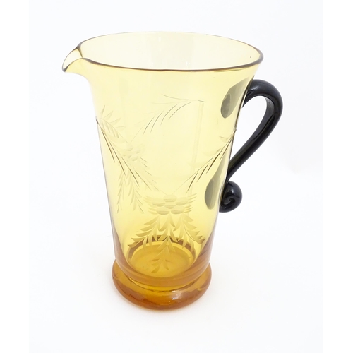 315 - An amber glass lemonade set comprising jug and 6 glasses with foliate decoration  lemonade set. the ... 