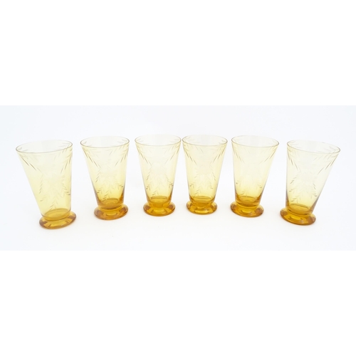 315 - An amber glass lemonade set comprising jug and 6 glasses with foliate decoration  lemonade set. the ... 