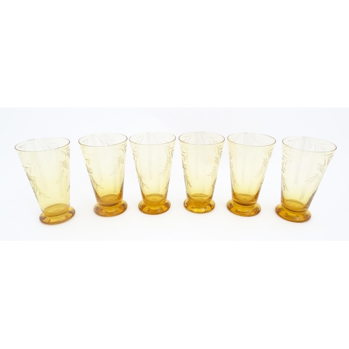 315 - An amber glass lemonade set comprising jug and 6 glasses with foliate decoration  lemonade set. the ... 