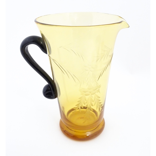 315 - An amber glass lemonade set comprising jug and 6 glasses with foliate decoration  lemonade set. the ... 