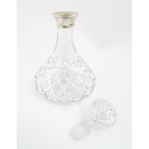 316 - A lead crystal decanter with silver mount hallmarked Birmingham 1978, maker Mappin & Webb. Approx. 1... 