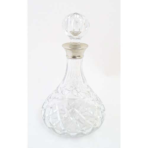 316 - A lead crystal decanter with silver mount hallmarked Birmingham 1978, maker Mappin & Webb. Approx. 1... 